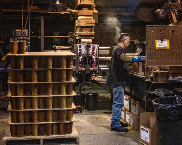 a man making and packing foundry cores